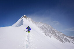 Mountaineer ascending Trugberg, Grindelwald, Bernese Oberland, Switzerland