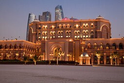Emirates Palace hotel and high-rise buildings at dusk, Abu Dhabi, United Arab Emirates