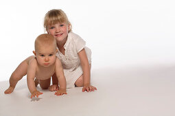 Girl and baby girl crawling