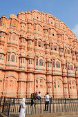 India tourists taking pictures in front of palace of winds, palace of winds, Hawa Mahal, Jaipur, Rajasthan, India