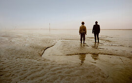 Two men in the Wadden Sea, East Frisian Wadden Sea, East Friesland, North Sea, Lower Saxony, Germany, Europe