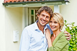 Young couple in front of a house, Hamburg, Germany