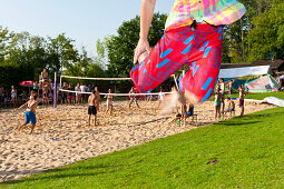 Teenagers playing beach volleyball at Lake Starnberg, Upper Bavaria, Germany, Europe