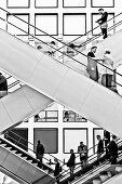 People, business people on escalators, Berlin Exhibition, Berlin, Germany