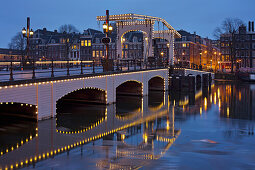 Magere Brug over the river Amstel at dusk, Amsterdam, North Holland, Netherlands