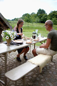 Couple having coffee and fresh cake, Klein Thurow, Roggendorf, Mecklenburg-Western Pomerania, Germany