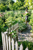 Woman gardening, Klein Thurow, Roggendorf, Mecklenburg-Western Pomerania, Germany