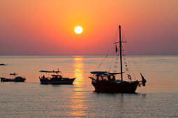 Sailing boats at sunrise on the sea, Cirali, Mediterranean Sea, Lycia, Turkey
