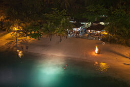 Beach party with bonfire at night, Port Antonio, Portland, Jamaica, Caribbean