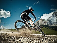 Male mountain biker riding downhill