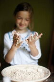 Girl with sticky hands, Klein Thurow, Roggendorf, Mecklenburg-Western Pomerania, Germany