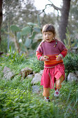 Girl easter eggs hunting, Santanyi, Majorca, Balearic Islands, Spain