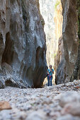 Young women hiking, canyon Torrent de Pareis Cala de Sa Calobra, Serra de Tramuntana, UNESCO Weltnaturerbe, Mallorca, Spain
