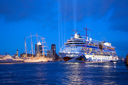 Cruise ship AIDAluna clearing port, in front of the Hafen City, Hamburg, Germany, Europe