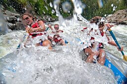 Jessica Florian, Jed Weber and Shannon Otto whitewater rafting the Cabarton section on the North Fork of the Payette River near the city of Cascade in central Idaho