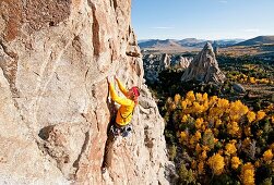 Nic Houser rock climbing a route called Shes The Bosch which is rated 5,11 and located on Window Rock at The City Of Rocks National Reserve near the town of Almo in southern Idaho