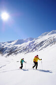 Two cross-country skiers ascending to mount Kreuzspitze, East Tyrol, Tyrol, Austria