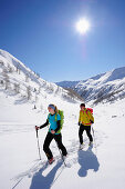 Two cross-country skiers ascending to mount Kreuzspitze, East Tyrol, Tyrol, Austria