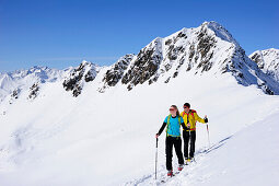 Two cross-country skiers ascending to mount Kreuzspitze, East Tyrol, Tyrol, Austria