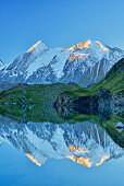 Combin de Corbassiere and Petit Combin reflecting in a mountain lake, Pennine Alps, Valais, Switzerland