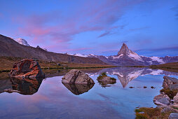 Matterhorn reflecting in a mountain lake, Pennine Alps, Valais, Switzerland