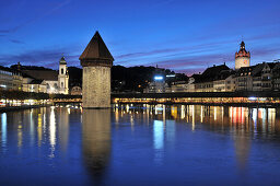 Illuminated Kapellbruecke bridge in the evening, Luzern, Switzerland, Europe