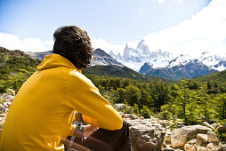 Man looking at the Fitz Roy Massif, El Chalten, Patagonia, Argentina