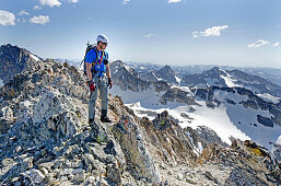 Elijah Weber on the summit after climbing The June Couloir on the North Face of Williams Peak high above the Sawtooth Valley in the Sawtooth Mountains near the town of Stanley in central Idaho