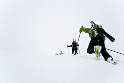 Two skiers ascending to mount Alpspitze, Garmisch-Partenkirchen, Bavaria, Germany