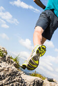 Man running on a mountain path, Risserkogel, Isarwinkel, Bavaria, Germany