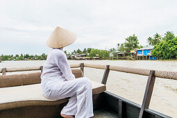 Woman with straw hat on the Mekong river, south Vietnam, Vietnam, Asia