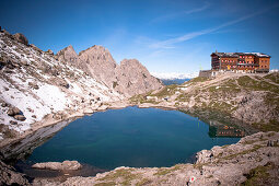 Hut with mountain lake in the lienz dolomites, East Tyrol, Tyrol, Austria