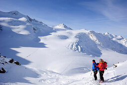 Two backcountry skiers ascending to Wildspitze, Oetztal Alps, Tyrol, Austria