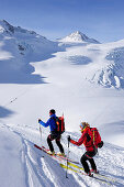 Two backcountry skiers ascending to Wildspitze, Oetztal Alps, Tyrol, Austria