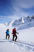 Two backcountry skiers ascending to Wildspitze, Oetztal Alps, Tyrol, Austria