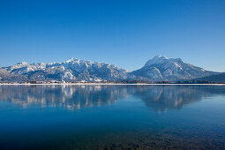 View across Lake Forggensee to the Allgaeu Alps with Tegelberg and Saeuling, Allgaeu, Bavaria, Germany