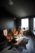 Man passing a lounge in a hotel room, Paris, France