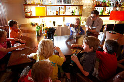 Children learning how to mix cocktails, children program in Hotel Haus Hirt, Bad Gastein, St. Johann im Pongau, Salzburg, Austria