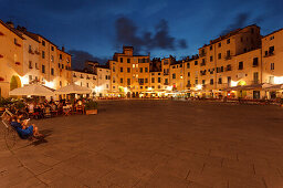 Piazza dell Anfiteatro square with restaurants in the historic centre of Lucca, UNESCO World Heritage Site, Tuscany, Italy, Europe