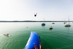Blop jump into Lake Starnberg, Bavaria, Germany