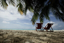Two beach chairs at sandy beach, Biyadhoo Island, South Male Atoll, Maldive Islands