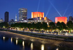 Royal National Theatre with red lights at night, Waterloo Bridge, Bankside, London, England