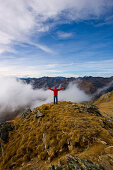 Hiker on mount Deneck, Schladminger Tauern, Styria, Austria