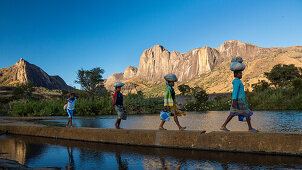 Madagascan girls in front of the Tsaranoro Massif, highlands, South Madagascar, Africa