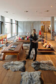 Woman standing in a lounge of a hotel, HafenCity, Hamburg, Germany