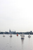 Boats sailing on a calm day, Outer Alster Lake, Hamburg, Germany
