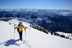 Female backcountry skier ascending to Hinteres Sonnwendjoch, Mangfall Mountains, Bavarian Prealps, Tyrol, Austria