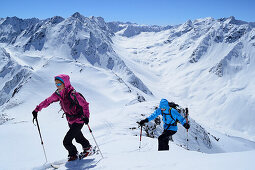 Two female backcountry skiers ascending to Gleirscher Rosskogel, Pforzheim Hut, Sellrain, Stubai Alps, Tyrol, Austria