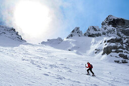 Female backcountry skier ascending to Hocheisspitze, Berchtesgaden Alps, Upper Bavaria, Bavaria, Germany