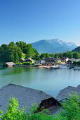 View to boat houses and town of Koenigssee at lake Koenigssee, Untersberg in background, lake Koenigssee, Berchtesgaden range, National Park Berchtesgaden, Berchtesgaden, Upper Bavaria, Bavaria, Germany